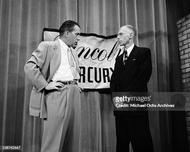 Ed Sullivan talks with a guest for "Toast of the Town" hosted by Ed Sullivan at the Maxine Elliott Theater in New York, New York.