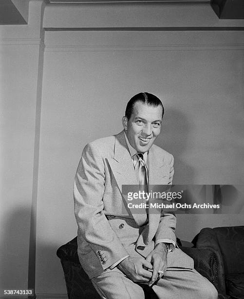 Ed Sullivan host of "Toast of the Town" poses in his office at the Maxine Elliott Theater in New York, New York.