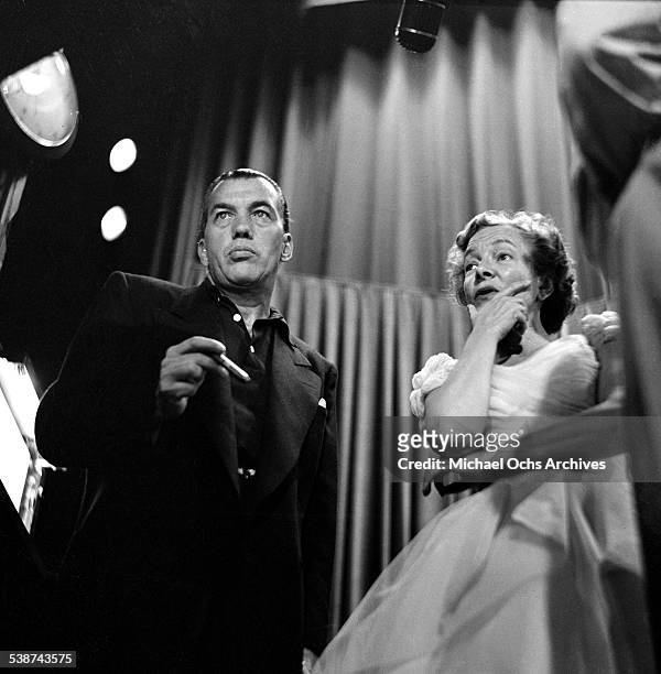 Actress Helen Hayes and Ed Sullivan watch the performances on stage during the "Toast of the Town" hosted by Ed Sullivan at the Maxine Elliott...