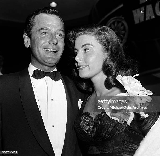 Actor Gig Young and Elaine Stewart attend the premire of "The Egyptian" in Los Angeles,CA.