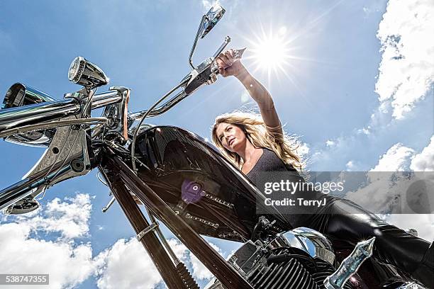 woman enjoys a motorcyle ride on sunny day - helicopter ride stock pictures, royalty-free photos & images