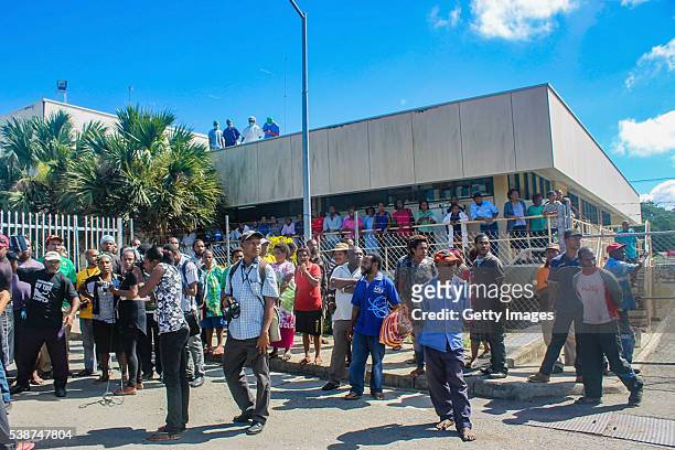 Family, friends and supporters of students injured during a government protest gather outside Port Moresby General Hospital on June 8, 2016 in Port...