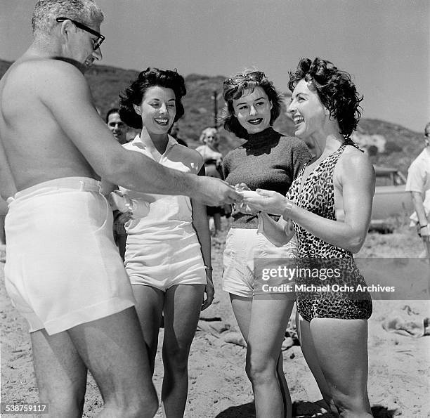 Actress Natalie Wood poses with actor Hugh O'Brian during the Thalians Beach Ball in Malibu,California.