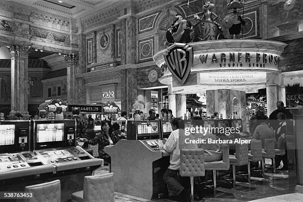 Blazing 777 slot machines in Caesar's Palace in Las Vegas, Nevada, January 1996.