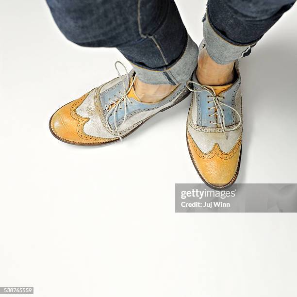 woman wearing shoes backward - oxford shoe stock pictures, royalty-free photos & images