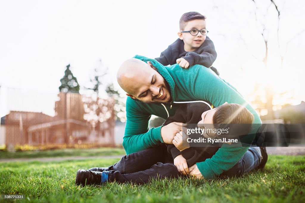 Dad Playing Outside with His Boys