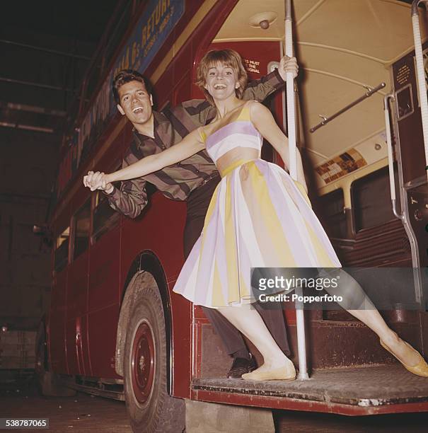 British pop singer and actor, Cliff Richard and American actress Lauri Peters pictured together in character as Don and Barbara on the rear platform...