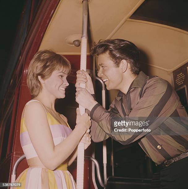 British pop singer and actor, Cliff Richard and American actress Lauri Peters pictured together in character as Don and Barbara on the rear platform...