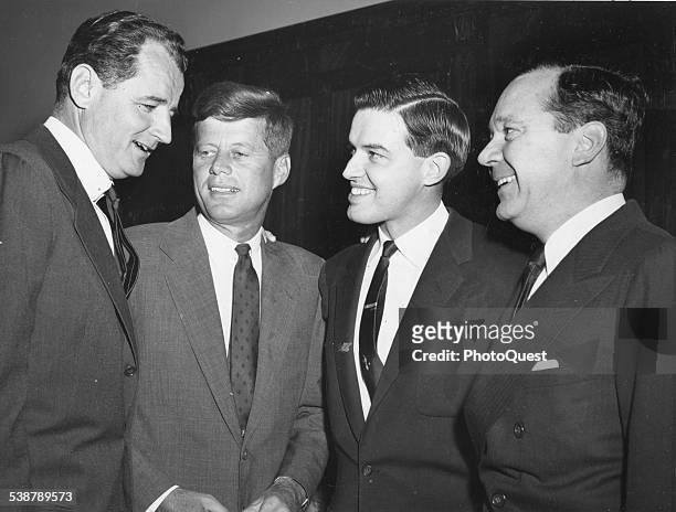 Four of the youngest Senators confer during the Senate Democratic organizational meeting prior to the opening of the 85th Congress, Washington DC,...