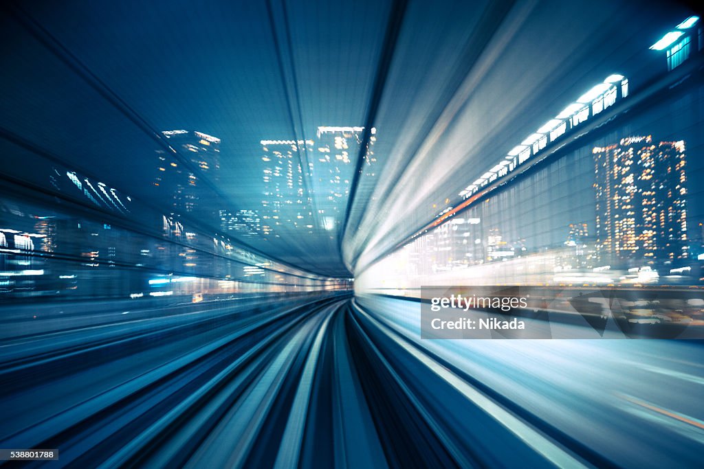 Motion blur of train moving to City