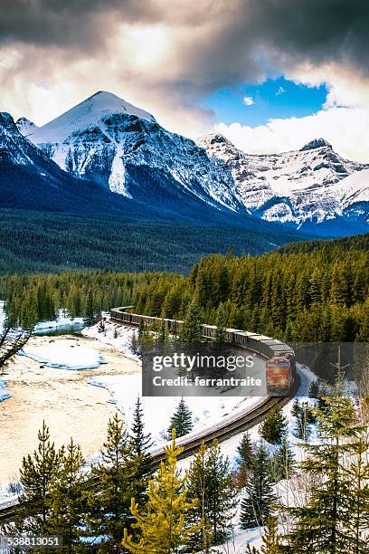 canadian pacific railway train through banff national park canada - banff canada stock pictures, royalty-free photos & images