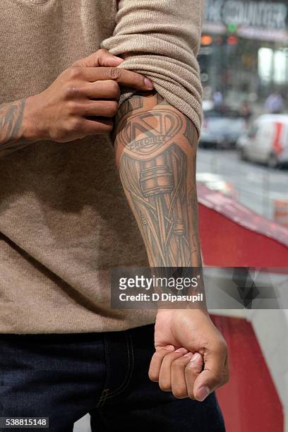 Nick Cannon, tattoo detail, visits "Extra" at their New York studios at H&M in Times Square on June 8, 2016 in New York City.