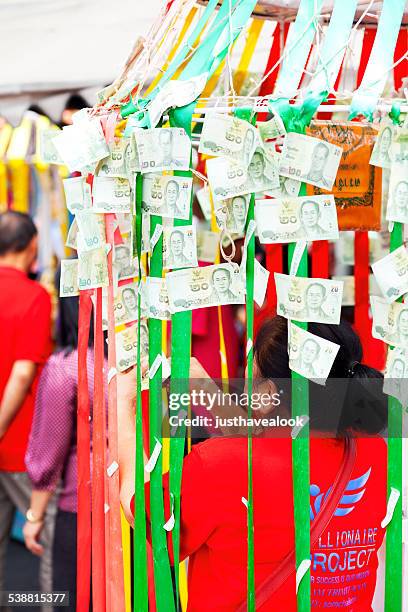 money for good luck at chinese new year - thai coin stock pictures, royalty-free photos & images