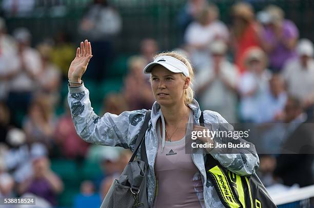 Caroline Wozniacki of Denmark walks off after her women's singles match against Anett Kontaveit of Estoniaon day three of the WTA Aegon Open on June...