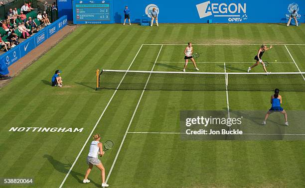 Jocelyn Rae and Anna Smith of Great Britain in action during their women's doubles match against Alla Kudryavtseva of Russia and Lin Zhu of China on...