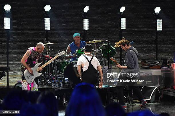 Musicians Flea, Chad Smith, Anthony Kiedis and Josh Klinghoffer of Red Hot Chili Peppers perform onstage during their album release party on AT&T...