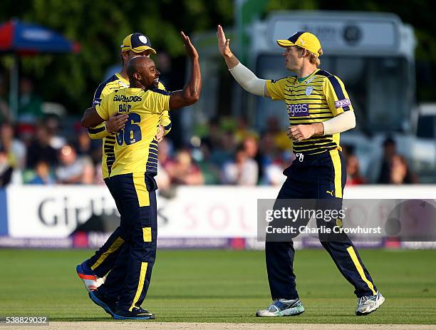 Tino Best of Hampshire celebrates taking the wicket of Joe Denly of Kent with team mates during the NatWest T20 Blast match between Kent and...