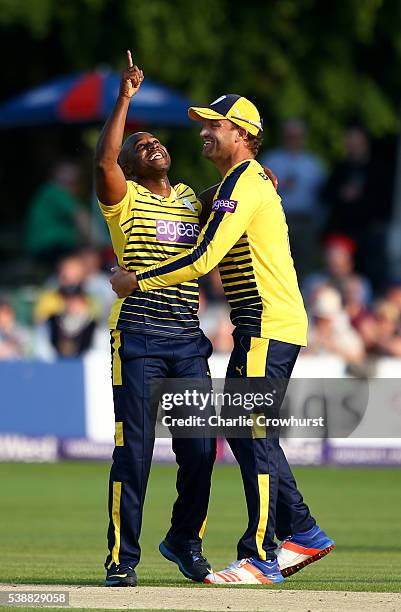 Tino Best of Hampshire celebrates taking the wicket of Joe Denly of Kent with team mate Sean Ervine during the NatWest T20 Blast match between Kent...