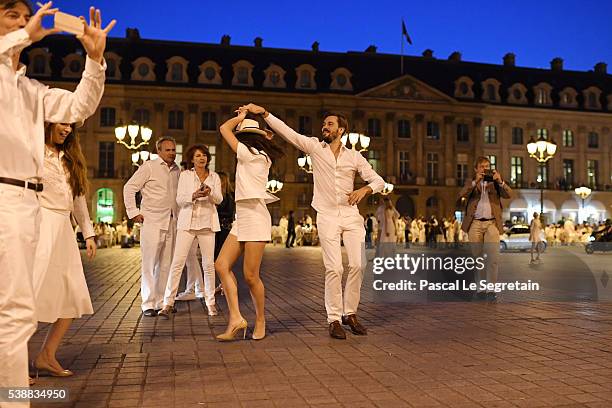 Guests dance during The 28th 'Diner En Blanc' - Dinner In White In Paris on June 8, 2016 in Paris, France.