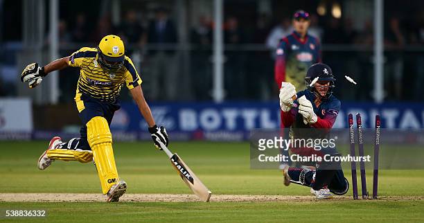 Shahid Afridi of Hampshire goes close to being run out by Sam Billings of Kent looks on during the NatWest T20 Blast match between Kent and Hampshire...
