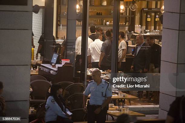 Israeli Prime Minister Benjamin Netanyahu visits at the scene of a shooting outside Max Brenner restaurant in Sarona Market on June 8, 2016 in Tel...