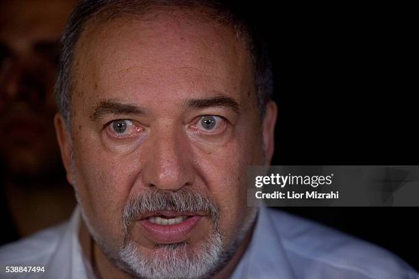 Israeli Defence Minister Avigdor Liberman speaks to the press at the scene of a shooting outside Max Brenner restaurant in Sarona Market on June 8,...