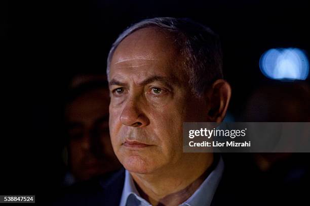 Israeli Prime Minister Benjamin Netanyahu speaks to the press at the scene of a shooting outside Max Brenner restaurant in Sarona Market on June 8,...