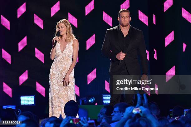 Host Erin Andrews and Co-Host JJ Watt onstage during the 2016 CMT Music awards at the Bridgestone Arena on June 8, 2016 in Nashville, Tennessee.