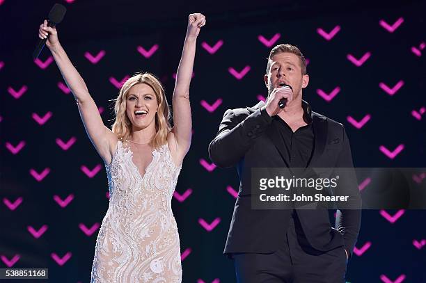 Host Erin Andrews and Co-Host JJ Watt onstage during the 2016 CMT Music awards at the Bridgestone Arena on June 8, 2016 in Nashville, Tennessee.