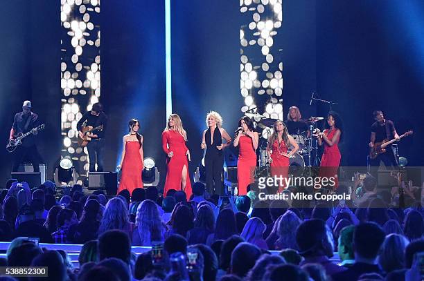 Ally Brooke, Normani Kordei, Dinah Jane, Camila Cabello, and Lauren Jauregui from musical group Fifth Harmony and singer-songwriter Cam onstage...