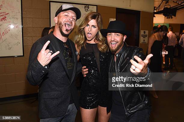 Chris Lucas and Preston Brust of LoCash pose with Cassadee Pope backstage during the 2016 CMT Music awards at the Bridgestone Arena on June 8, 2016...