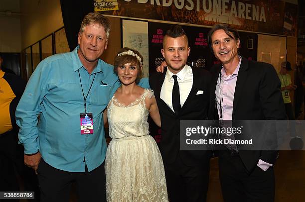 S John Huie, actress Clare Bowen, fiance Brandon Robert Young, and CAA's Matt Maher attend the 2016 CMT Music awards at the Bridgestone Arena on June...