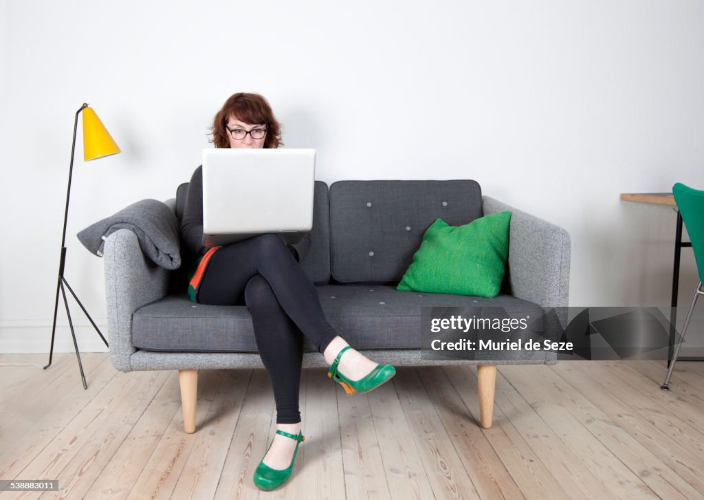 Woman with computer, home