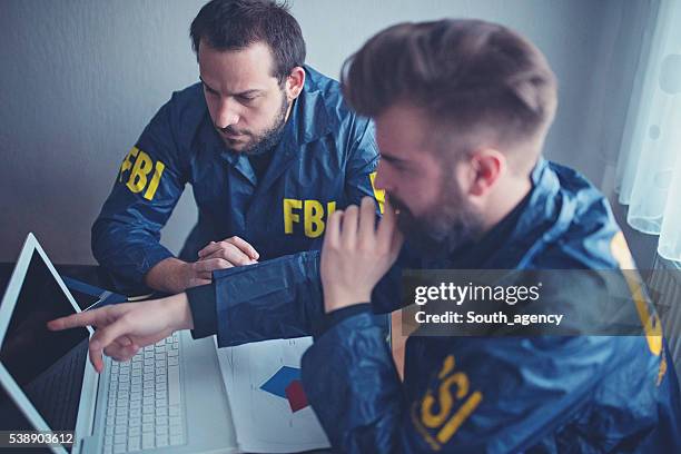 fbi team working - fbi stock pictures, royalty-free photos & images