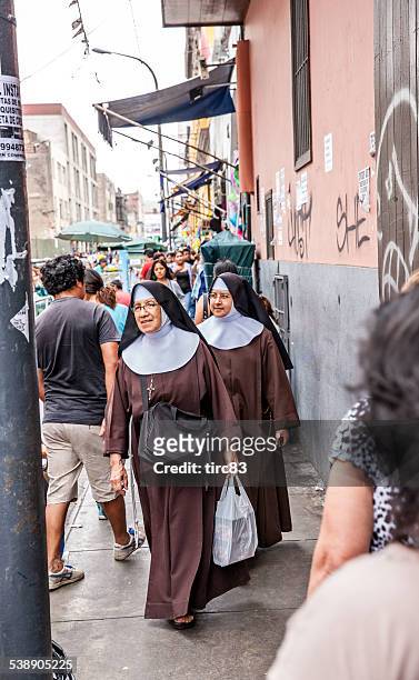 pair of nuns on lima street - nun stock pictures, royalty-free photos & images