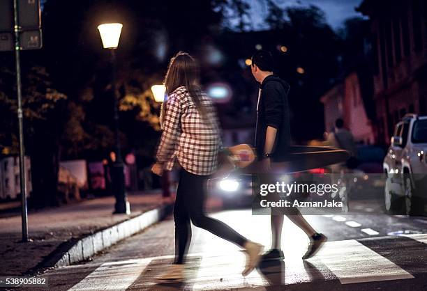 midnight walking - couple crossing street stock pictures, royalty-free photos & images