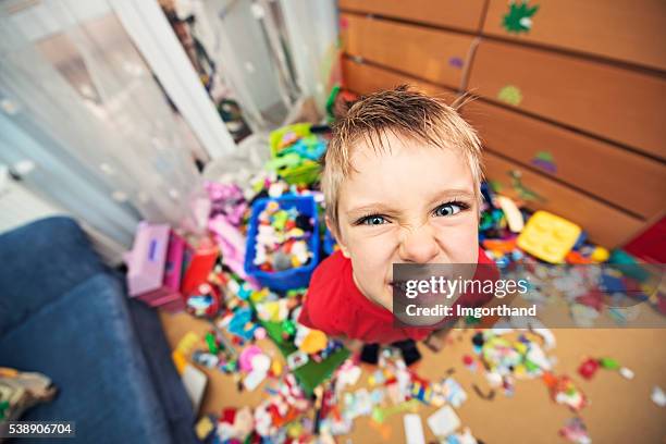 naughty and messy little boy - angry child stockfoto's en -beelden