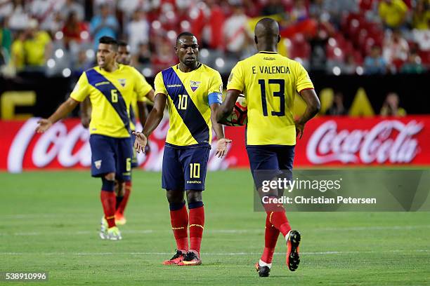 Walter Ayovi of Ecuador high-fives Enner Valencia after Valencia scored a goal against the Peru during the first half of the 2016 Copa America...