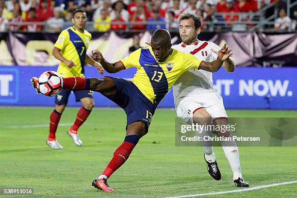 Enner Valencia of Ecuador shoots to score goal past Raul Ruidiaz of Peru during the first half of the 2016 Copa America Centenario Group B match at...