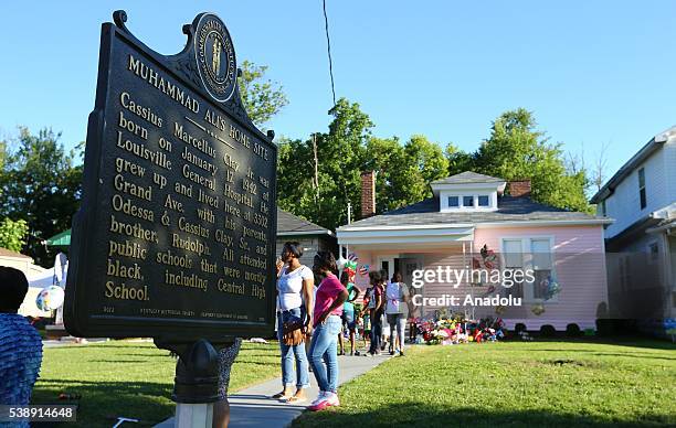 Mourners visit boxing legend Muhammed Ali's house following the death of him, in Louisville, Kentucky on June 8, 2016. Kentucky will conduct a public...