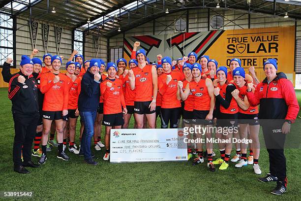 Neale Daniher and the Bombers team pose during an Essendon Bombers AFL media and training session at True Value Solar Centre on June 9, 2016 in...