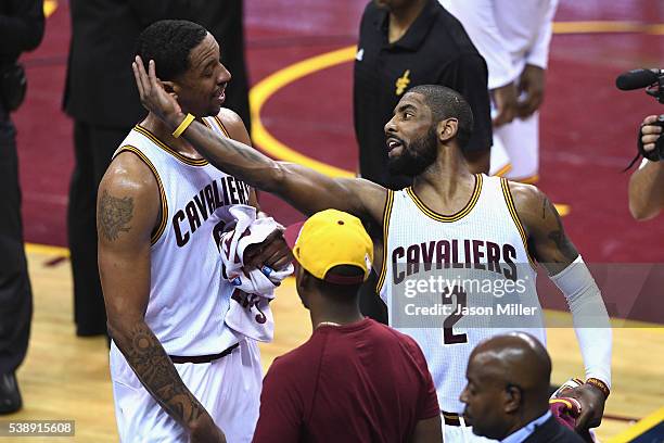 Channing Frye of the Cleveland Cavaliers and Kyrie Irving react during the second half against the Golden State Warriors in Game 3 of the 2016 NBA...