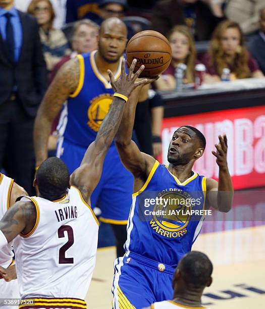 Golden State Warriors guard Ian Clark takes a shot over Cleveland Cavaliers guard Kyrie Irving during Game 3 of the NBA Finals in Cleveland, Ohio on...