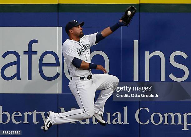 Right fielder Franklin Gutierrez of the Seattle Mariners catches a fly ball off the bat of Juan Uribe of the Cleveland Indians in the sixth inning at...