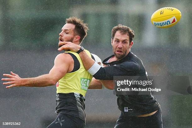 Nathan Brown and Travis Cloke compete for the ball during a Collingwood Magpies AFL media opportunity at the Glasshouse Theatre on June 9, 2016 in...