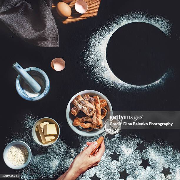 puff pastry with stars and moon - icing sugar stock pictures, royalty-free photos & images