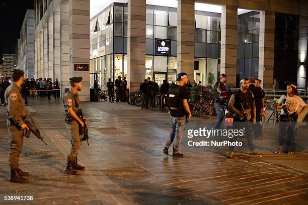Policemen are standing guard near the scene of a shooting attack in Sarona Market, Tel-Aviv on June 08'th, 2016. Four Israelis were killed and and 16...