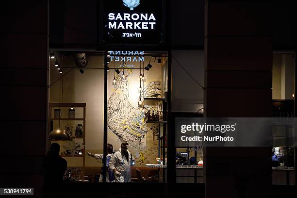 Policemen are investigating the scene of a shooting attack in Sarona Market, Tel-Aviv on June 08'th, 2016. Four Israelis were killed and and 16...