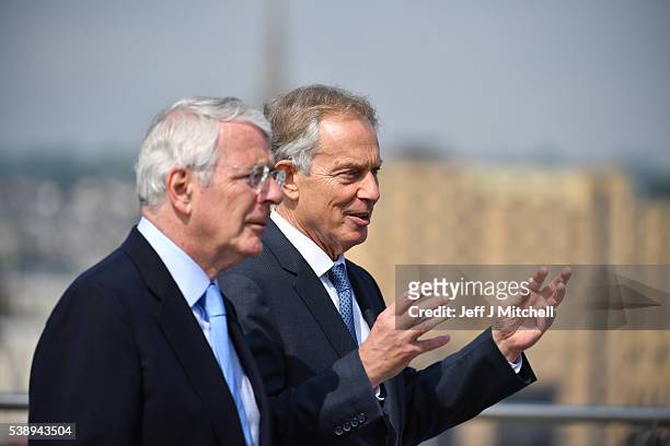 Sir John Major and Tony Blair speak as they walk across the Peace Bridge on June 9, 2016 in Derry, Northern Ireland. Former Prime Ministers Sir John...