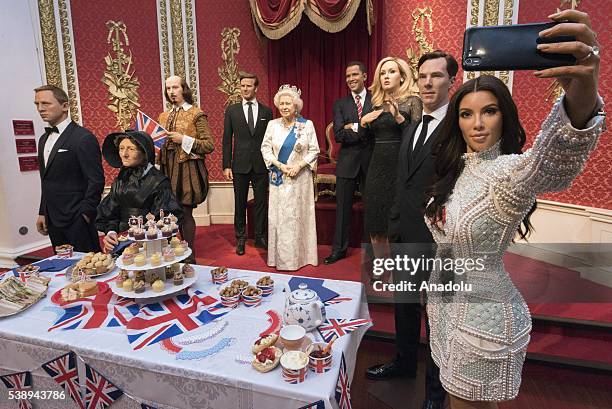 Madame Tussauds London marks Britain's Queen Elizabeth II 90th birthday with a star studded street party including waxworks of Daniel Craig, Madame...